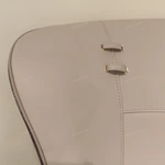 Panel-Stitched Leather Bed with Top Strap Details and High-Gloss Wooden Sides